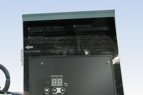 Control panel with a digital temperature display and SET, DOWN and UP buttons